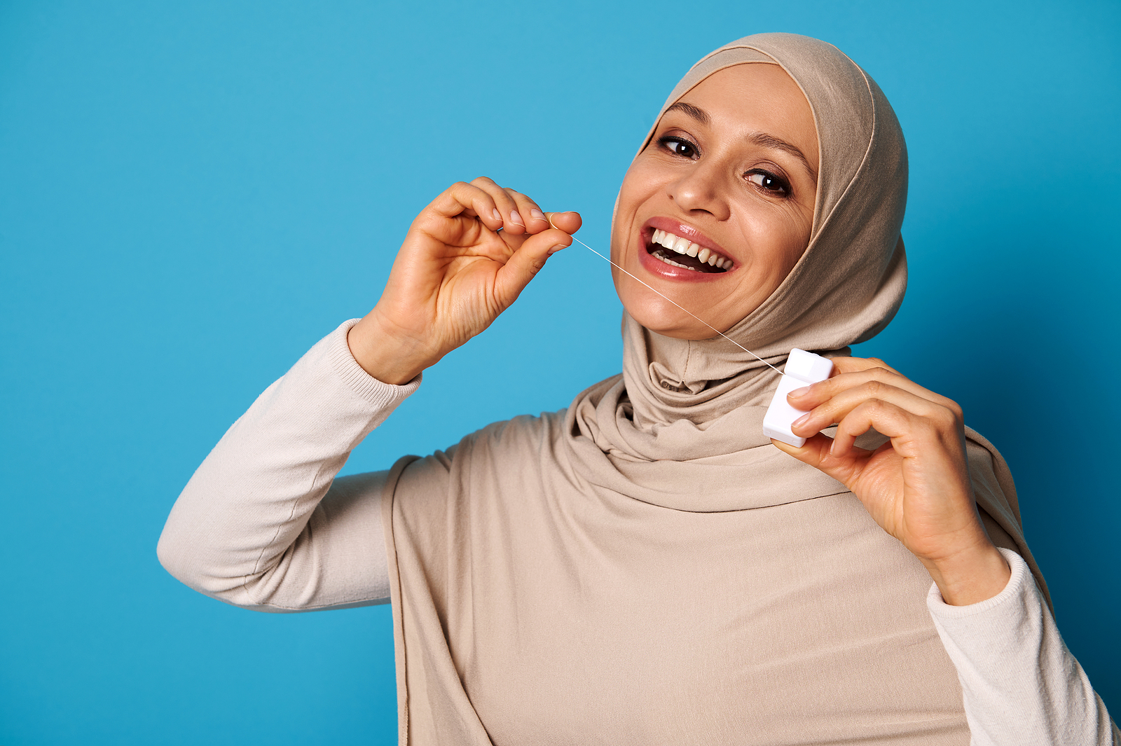 Flossing an Implant-Supported Bridge can Prevent a Damaging Gum Infection